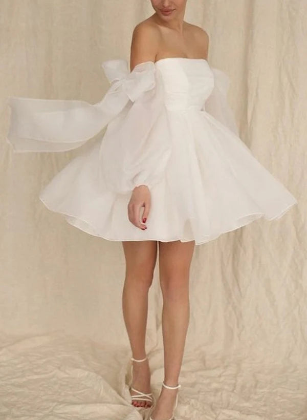 Abito da sposa corto a trapezio con fiocco e maniche lunghe a palloncino